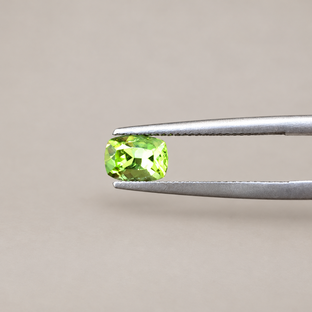 1.4ct Peridot/ Cushion cut