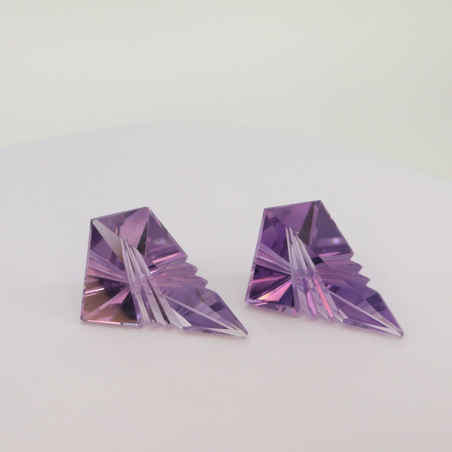A pair of Fantasy cut Amethyst gemstones (6.4ct and 6.2ct)