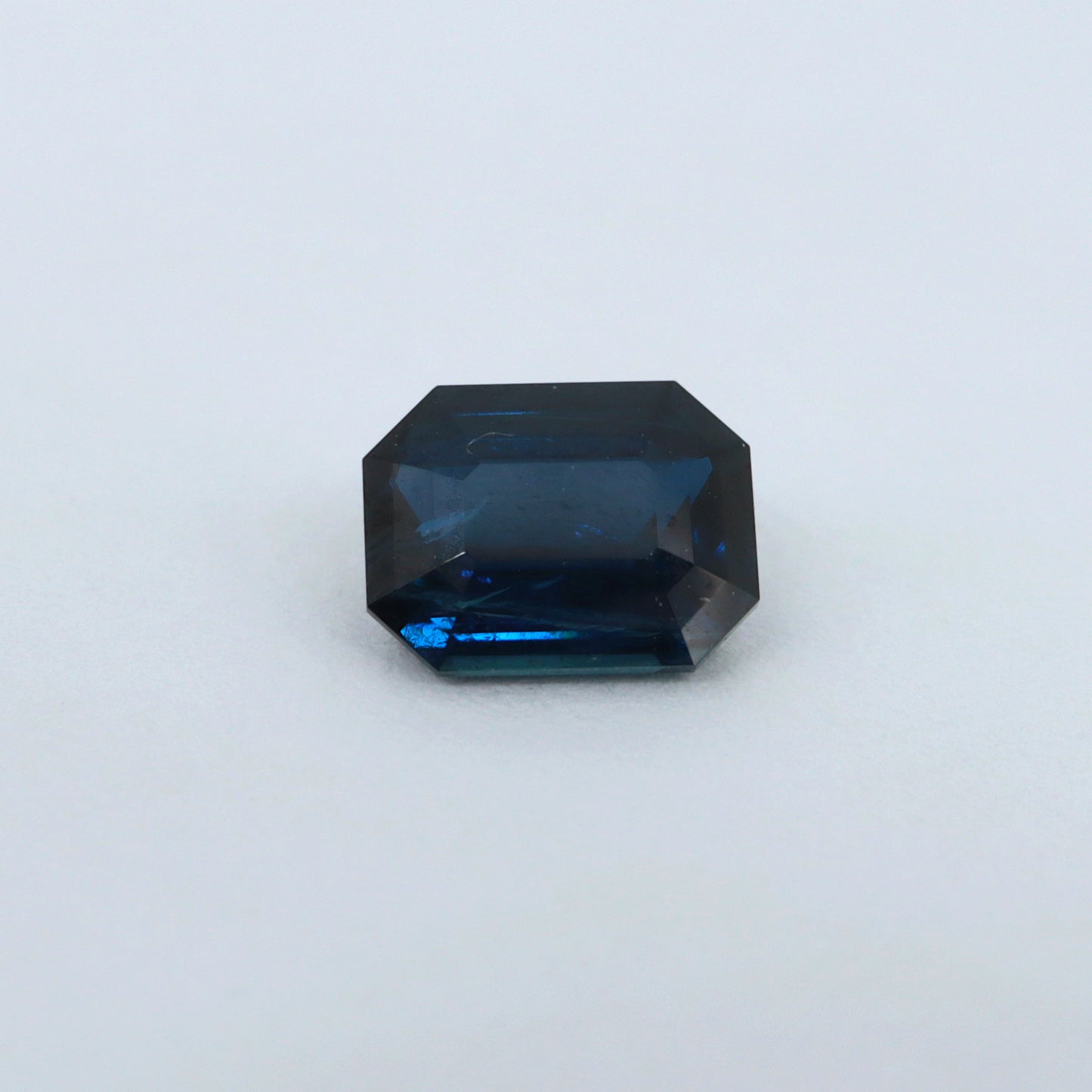 0.64ct  blue sapphire emerald cut