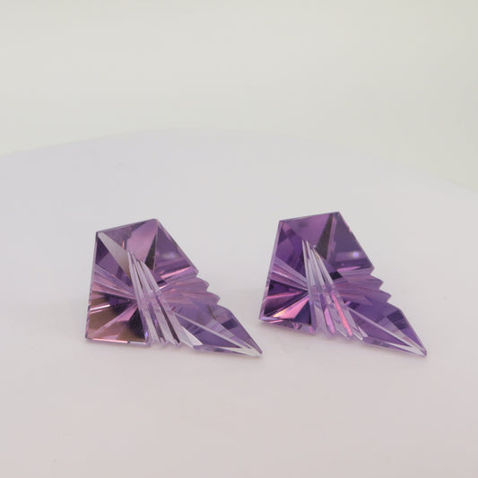A pair of  Fantasy cut Amethyst gemstones (6.4ct and 6.2ct)