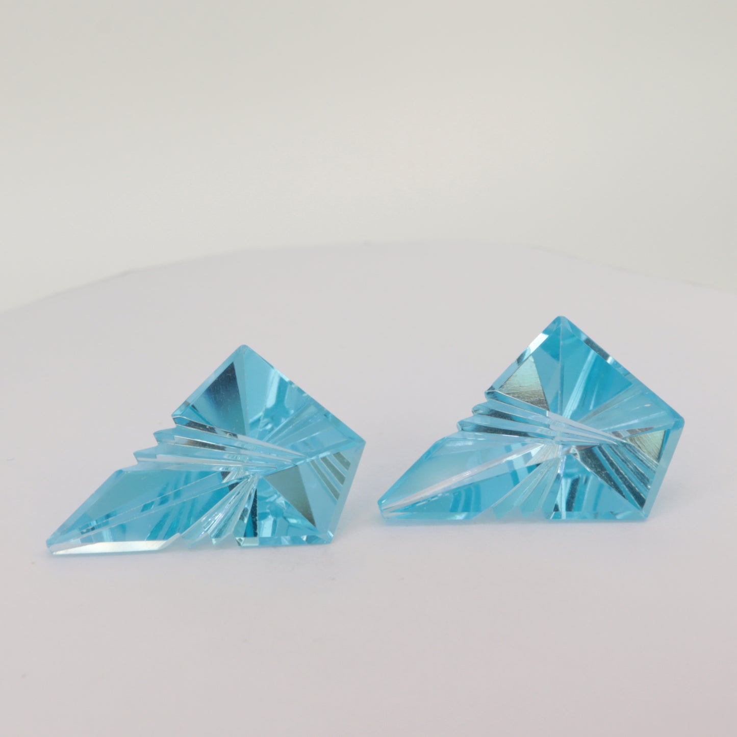 A pair of  Fantasy cut Blue Topaz gemstones (9.1ct and 8.6ct)